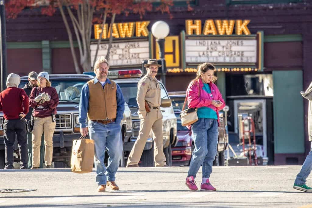 It is confirmed that David Harbour's Chief Jim Hopper will survive in Season 5. The image below shows that Indiana Jones and the Last Crusade is playing in theaters during the events of Season 5.