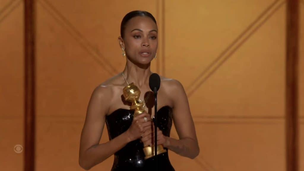 Zoe Saldaña with her first Golden Globe award for her performance in Emilia Pérez