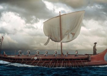 Christopher Nolan's upcoming adaptation of Homer's The Odyssey will be rated R, featuring mature themes and scenes of nudity. An intimacy coordinator has also been hired for the production.