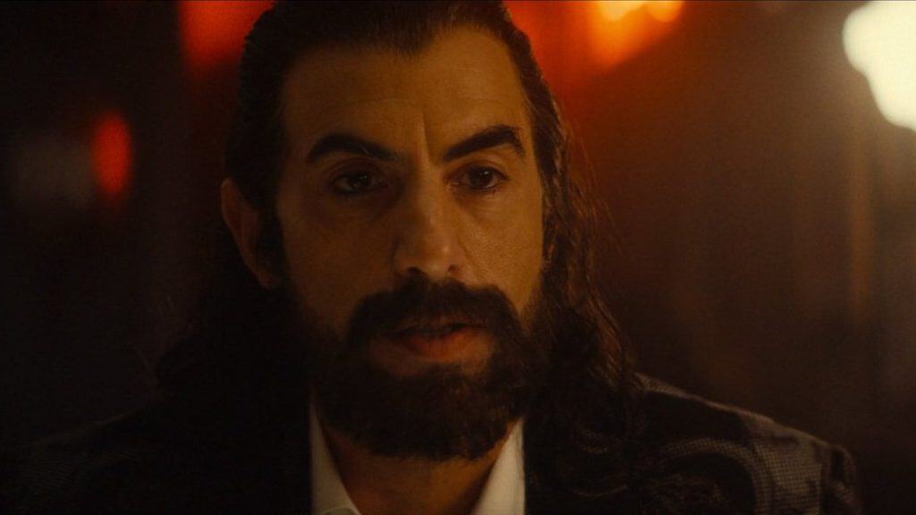In Episode 6 of Ironheart, "The Past Is the Past," Sacha Baron Cohen debuts as Mephisto, revealed to have given Parker Robbins the Hood in a dark deal.