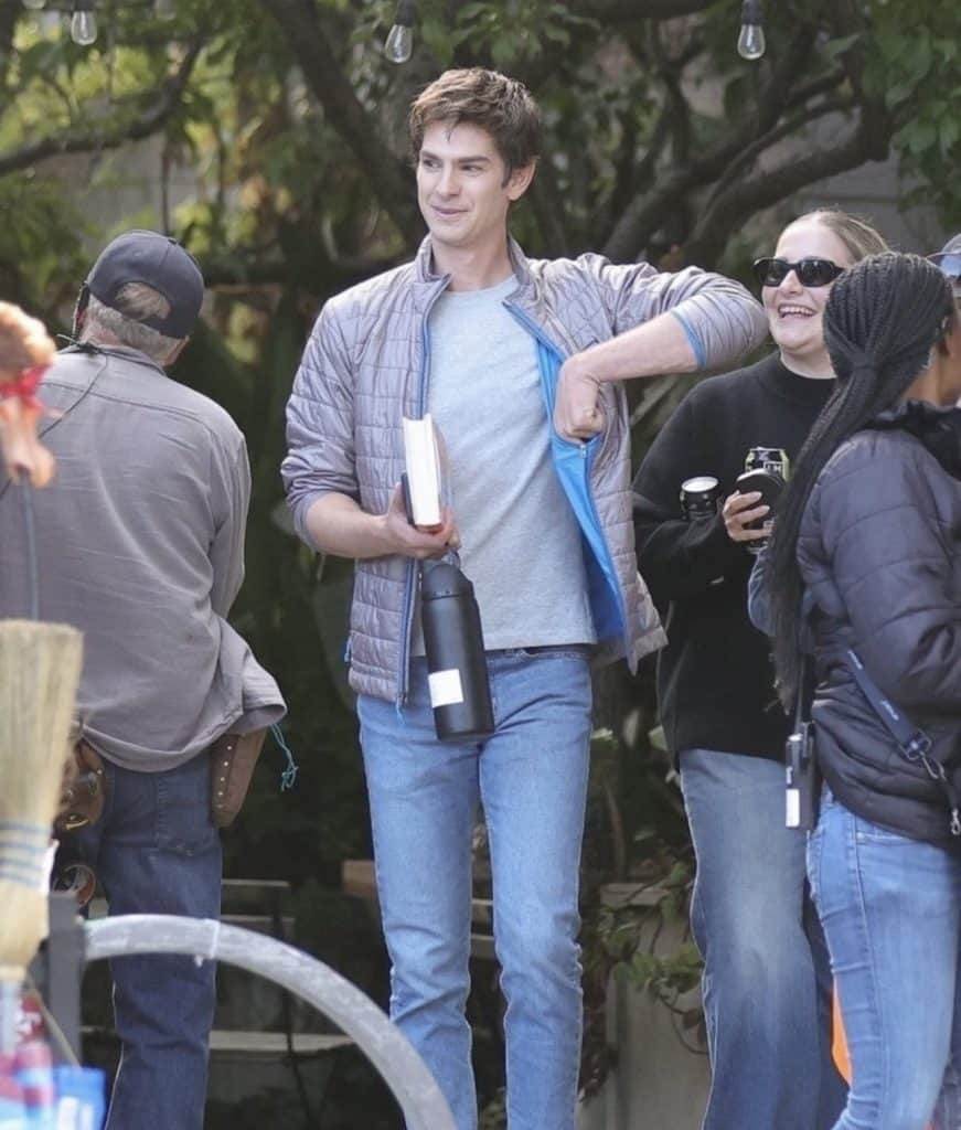 Filming for Luca Guadagnino’s OpenAI film Artificial has begun in San Francisco. Andrew Garfield was spotted on set as Sam Altman, wearing a silver puffer jacket, gray T-shirt, and jeans.