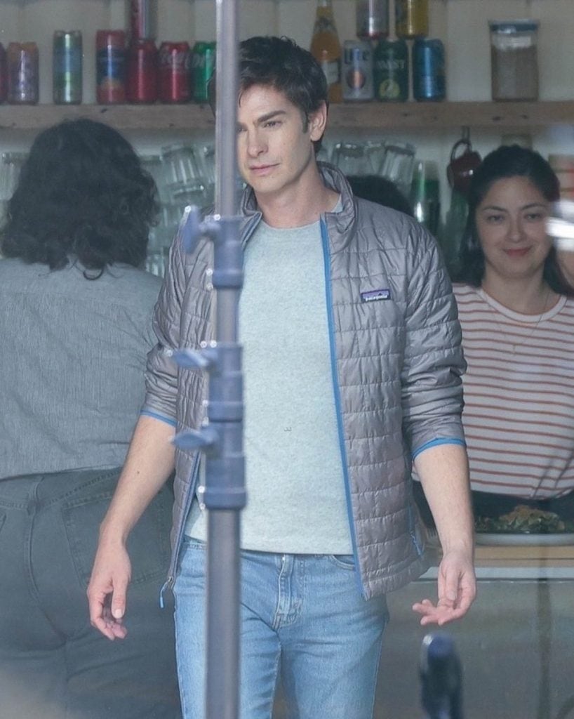 Filming for Luca Guadagnino’s OpenAI film Artificial has begun in San Francisco. Andrew Garfield was spotted on set as Sam Altman, wearing a silver puffer jacket, gray T-shirt, and jeans.