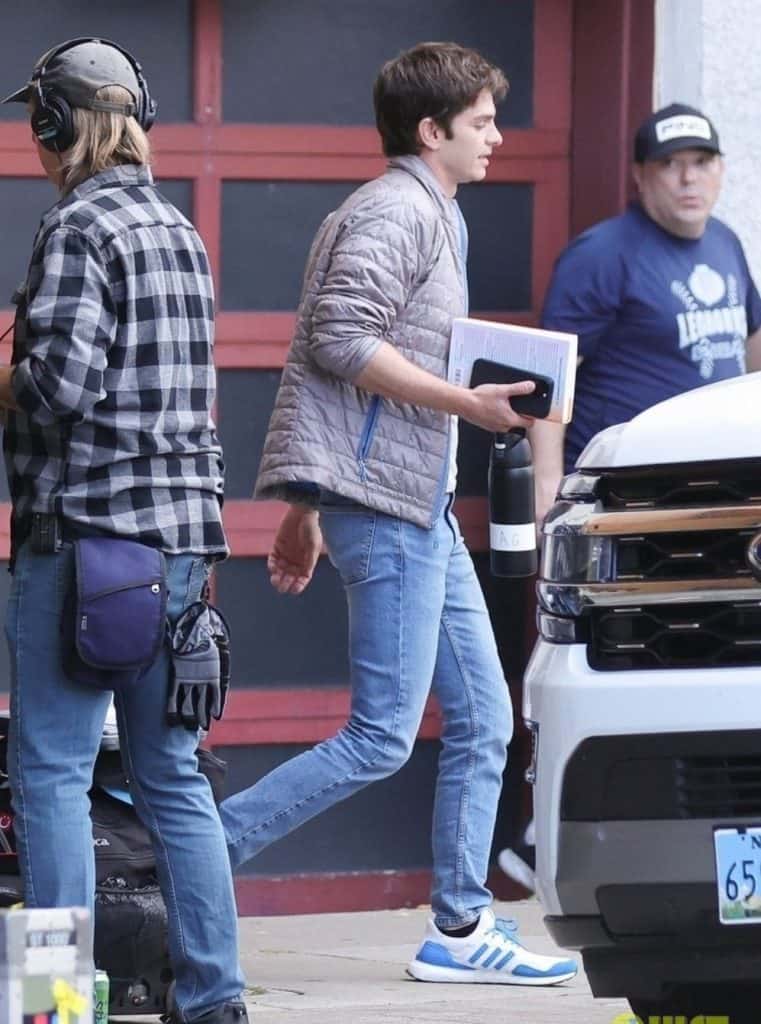 Filming for Luca Guadagnino’s OpenAI film Artificial has begun in San Francisco. Andrew Garfield was spotted on set as Sam Altman, wearing a silver puffer jacket, gray T-shirt, and jeans.