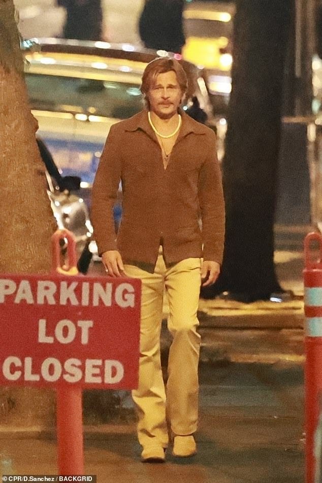 Brad Pitt and Elizabeth Debicki were spotted filming David Fincher's The Adventures of Cliff Booth in Los Angeles, showcasing their 1970s-inspired looks on set.