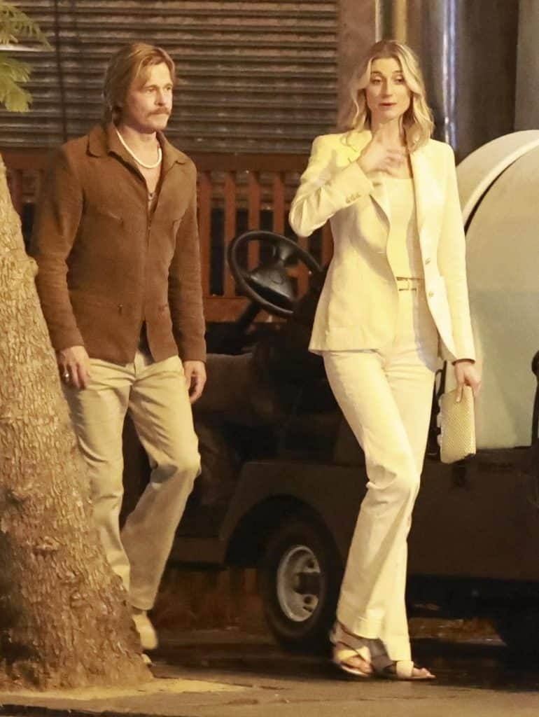 Brad Pitt and Elizabeth Debicki were spotted filming David Fincher's The Adventures of Cliff Booth in Los Angeles, showcasing their 1970s-inspired looks on set.