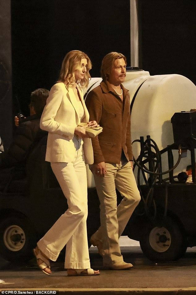 Brad Pitt and Elizabeth Debicki were spotted filming David Fincher's The Adventures of Cliff Booth in Los Angeles, showcasing their 1970s-inspired looks on set.