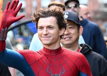 Tom Holland has been spotted on the set of Spider-Man: Brand New Day in Glasgow, Scotland. A leaked photo reveals him in a new Spider-Man suit, waving to fans.