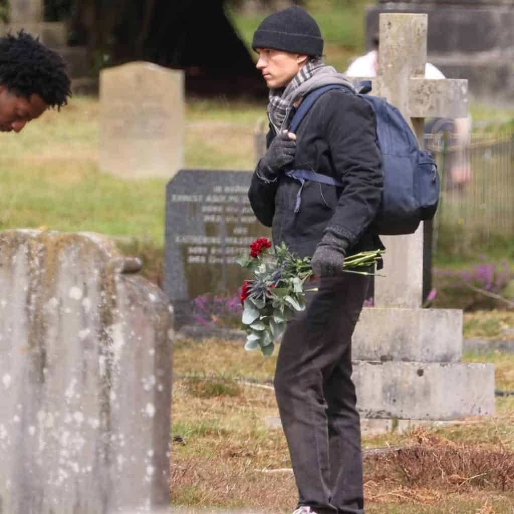 New set images from Marvel's Spider-Man: Brand New Day show Tom Holland's Peter Parker delivering flowers to Aunt May’s grave, filmed at Brookwood Cemetery in Surrey, London.