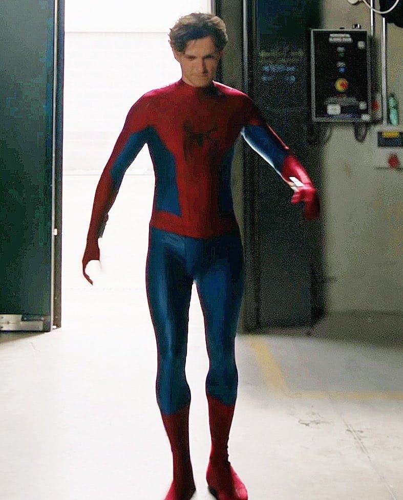 Marvel Studios and Sony Pictures have officially revealed the first look at Tom Holland wearing the new Spider-Man suit for Spider-Man: Brand New Day, showcasing subtle design changes and classic inspirations.