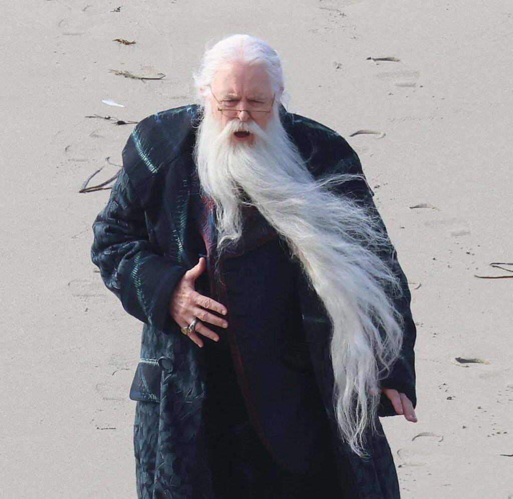 The first look at John Lithgow as Professor Albus Dumbledore in HBO’s Harry Potter series has been revealed, with filming taking place on a beach in Cornwall, England.