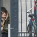 See Sadie Sink on the set of Marvel’s Spider-Man: Brand New Day with Tom Holland in London. She wears military-style boots and yellow pants, while director Destin Daniel Cretton is nearby.