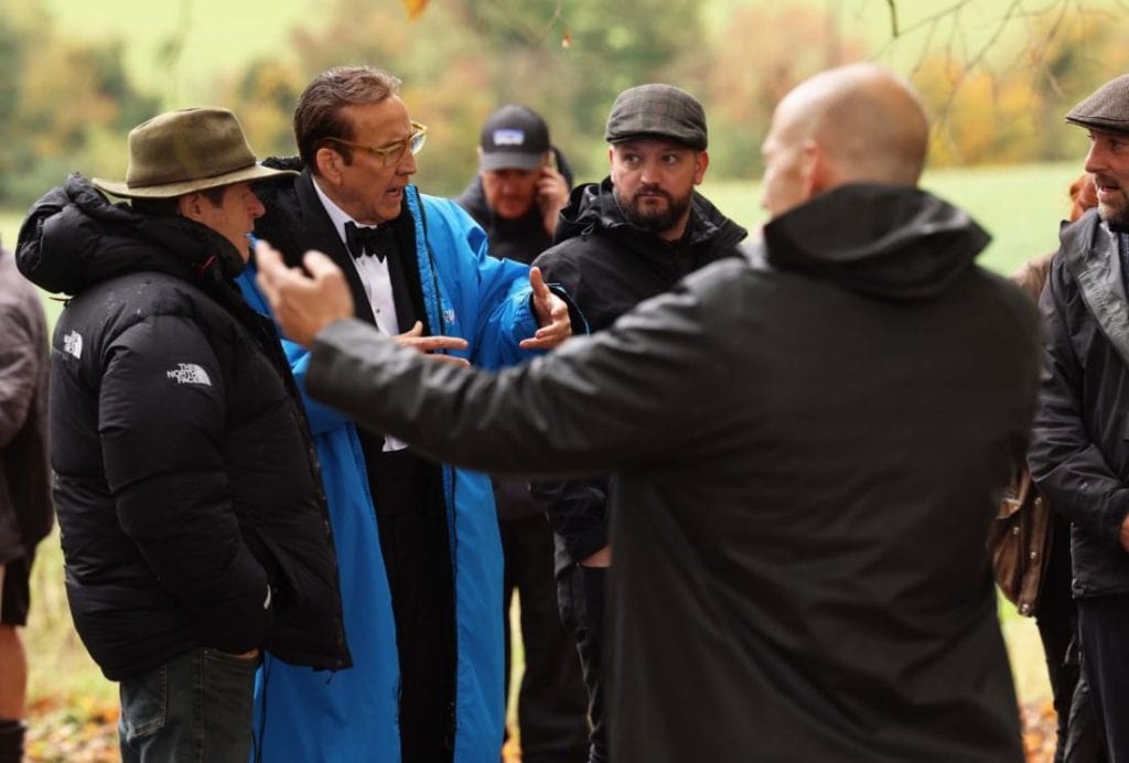 Nicolas Cage transforms into real-life spy Dusko Popov, the Yugoslavian double agent who inspired James Bond, in Simon West’s WWII thriller Fortitude. New set images reveal filming in the English countryside.