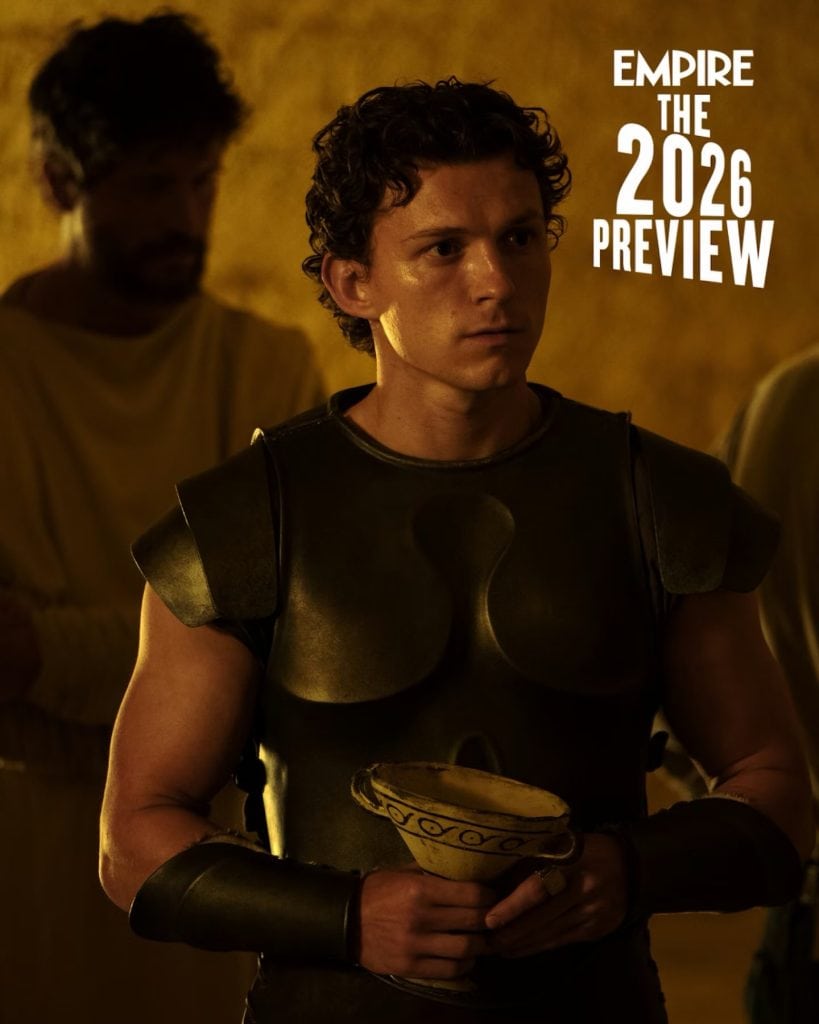 Exclusive first-look images from Christopher Nolan’s The Odyssey reveal Anne Hathaway as Penelope, Mia Goth as Melantho, and Tom Holland as Telemachus.