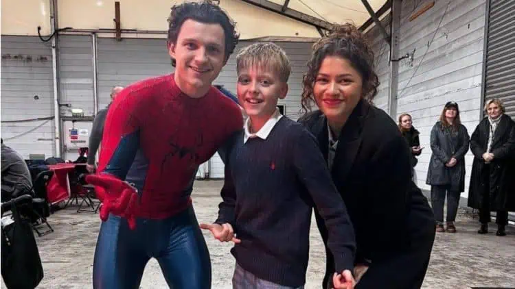 New set photos from Marvel's Spider-Man: Brand New Day show Tom Holland and Zendaya interacting with fans during filming at Pinewood Studios in the UK. Fans are excited as production ramps up for the next chapter in the Spider-Man saga.