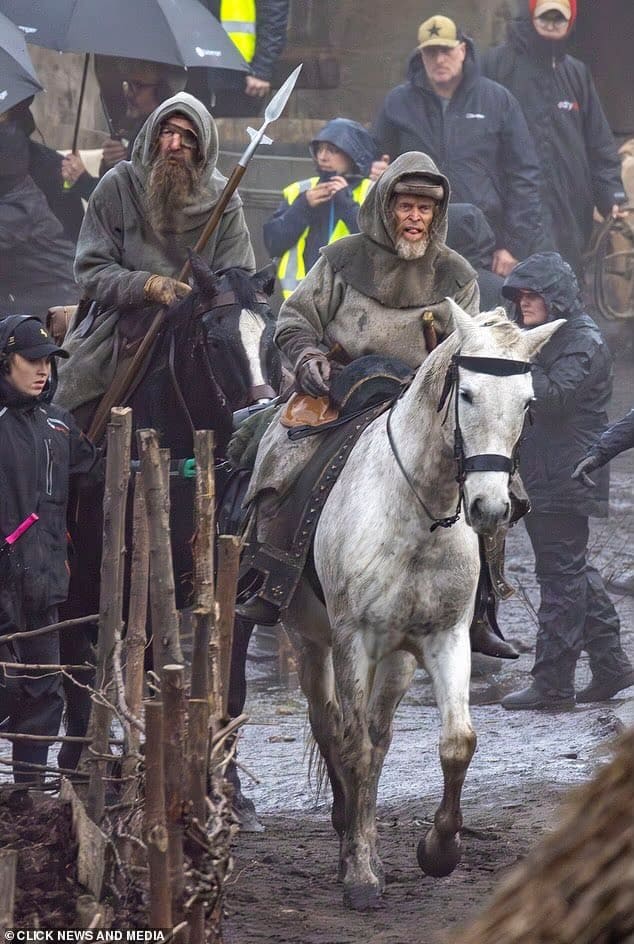 The first look at Robert Eggers’ Werwulf shows Dafoe, Ineson, and Taylor-Johnson in rugged medieval costumes on a muddy set in Bourne Wood, England.