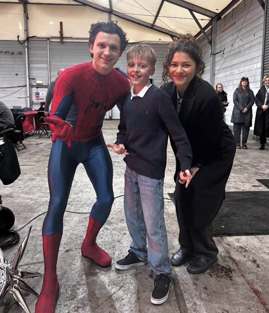 New set photos from Marvel's Spider-Man: Brand New Day show Tom Holland and Zendaya interacting with fans during filming at Pinewood Studios in the UK. Fans are excited as production ramps up for the next chapter in the Spider-Man saga.