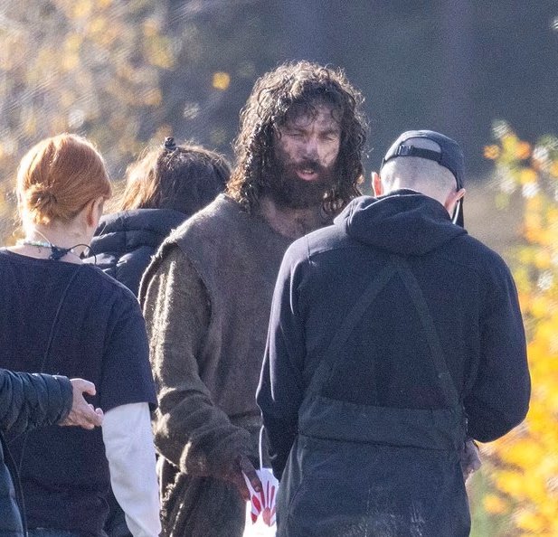 The first look at Robert Eggers’ Werwulf shows Dafoe, Ineson, and Taylor-Johnson in rugged medieval costumes on a muddy set in Bourne Wood, England.