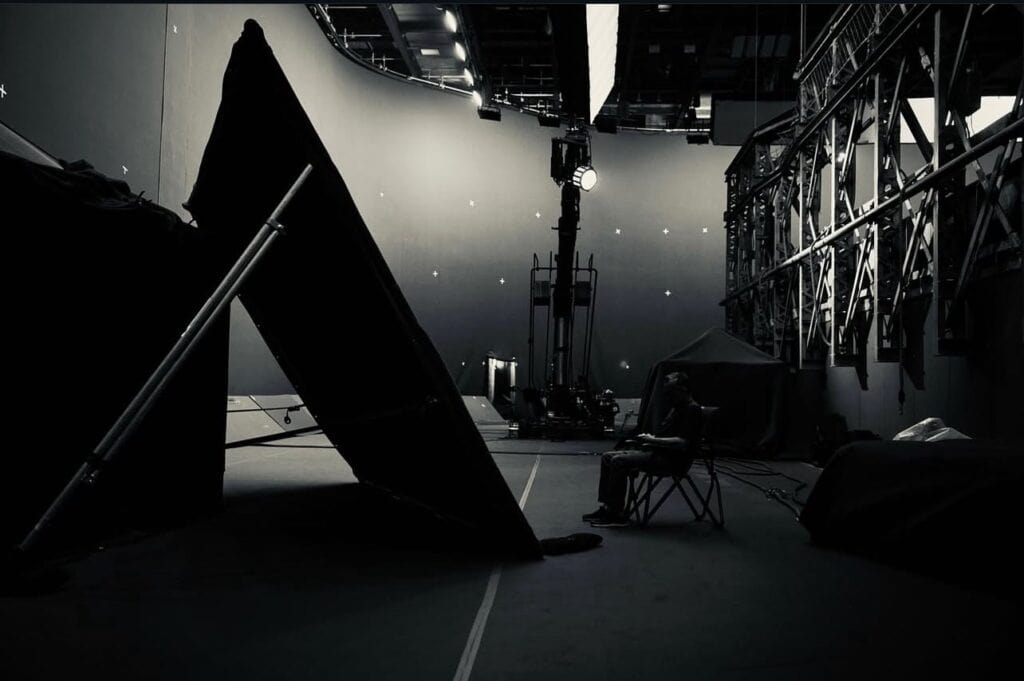 The Russo Brothers tease a cryptic Avengers: Doomsday set photo, reportedly revealing Doctor Doom’s tragic lab experiment that kills his family and leaves him disfigured.