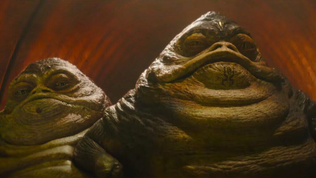 The Mandalorian and Grogu trailer reveals Pedro Pascal’s Din Djarin mask-off, Jeremy Allen White as Rotta the Hutt, Zeb Orrelios, Dragonsnake, and a surprise alien voice cameo.