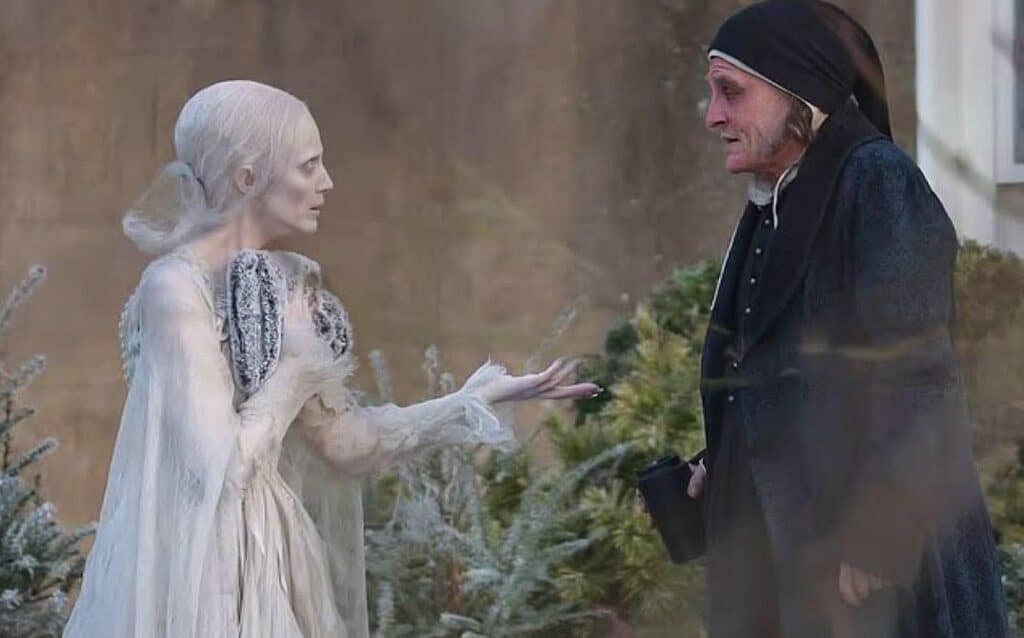 First look images reveal Johnny Depp as Ebenezer Scrooge and Andrea Riseborough as the Ghost of Christmas Past on the London set of Ti West’s Ebenezer: A Christmas Carol.