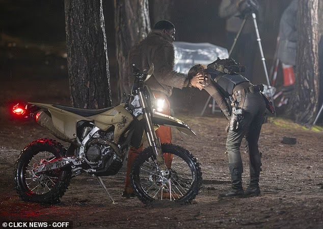 Sophie Turner is spotted filming intense action scenes for Amazon’s Tomb Raider series in Surrey, including a knife fight in heavy rain and a motorcycle escape with Martin Bobb-Semple as Zip.