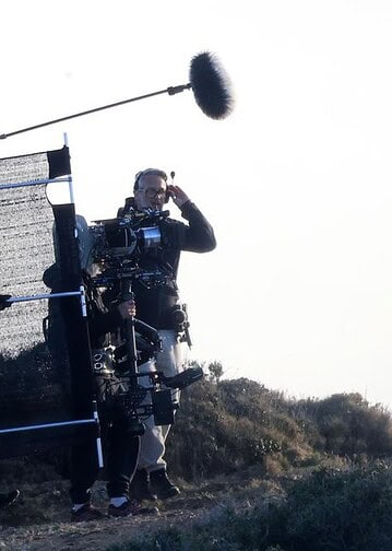 First look at Cillian Murphy and Mia Threapleton on the set of Damien Chazelle’s untitled film in Greece, featuring a prison-set story about a violent guard-inmate conflict.