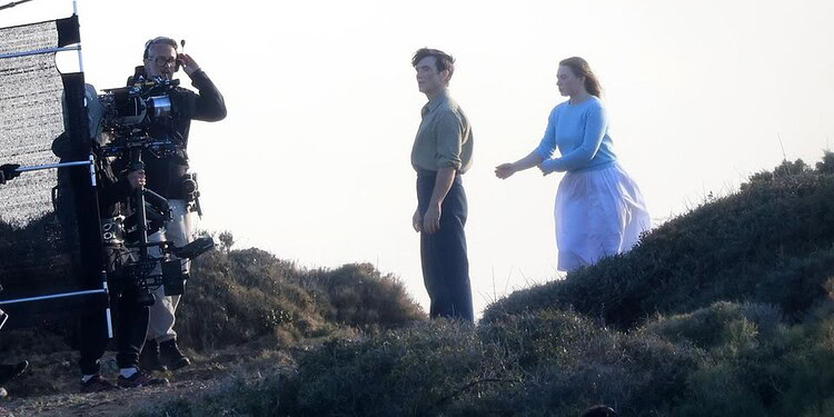 First look at Cillian Murphy and Mia Threapleton on the set of Damien Chazelle’s untitled film in Greece, featuring a prison-set story about a violent guard-inmate conflict.