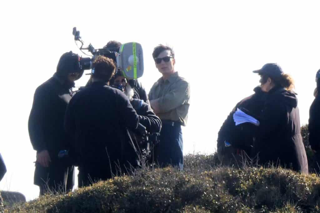 First look at Cillian Murphy and Mia Threapleton on the set of Damien Chazelle’s untitled film in Greece, featuring a prison-set story about a violent guard-inmate conflict.