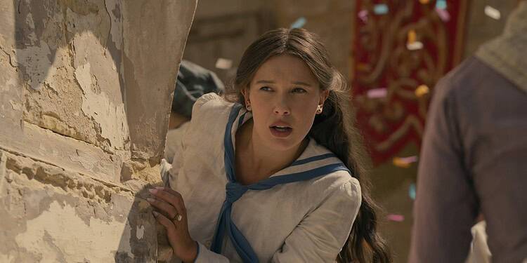 Netflix reveals the first look at Enola Holmes 3, with Millie Bobby Brown and Henry Cavill returning. The sequel premieres July 1 on Netflix.