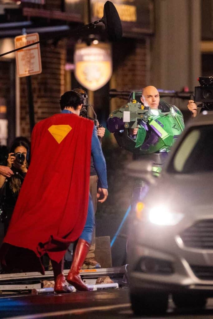 New Man of Tomorrow set photos reveal David Corenswet's battle-damaged Superman and Nicholas Hoult's armored Lex Luthor filming a major fight scene.
