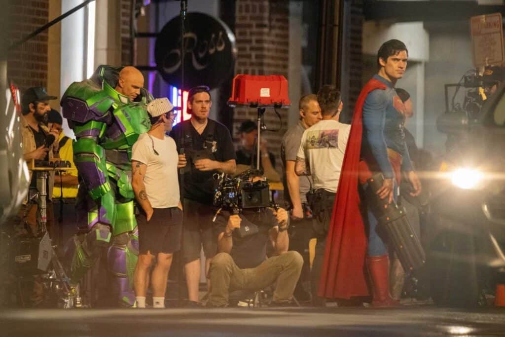 New Man of Tomorrow set photos reveal David Corenswet's battle-damaged Superman and Nicholas Hoult's armored Lex Luthor filming a major fight scene.