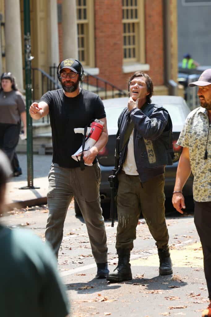 Cillian Murphy has been spotted filming A Quiet Place Part III in New York City, with new set photos showing Emmett in military gear and teasing a major look into his past.