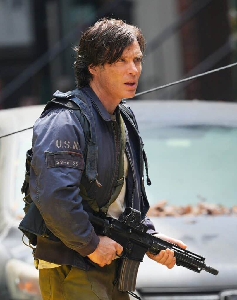 Cillian Murphy has been spotted filming A Quiet Place Part III in New York City, with new set photos showing Emmett in military gear and teasing a major look into his past.