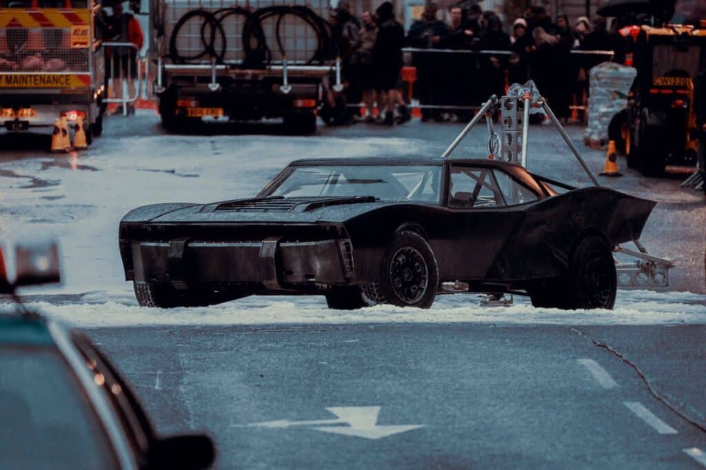 New The Batman: Part II set images and footage show the Batmobile performing stunts in artificial snow during filming in Glasgow.