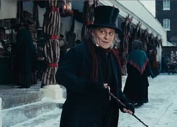 New first-look images from Ti West’s Ebenezer reveal Johnny Depp as Scrooge alongside Ian McKellen, Tramell Tillman, and Rupert Grint.