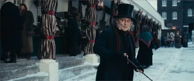 New first-look images from Ti West’s Ebenezer reveal Johnny Depp as Scrooge alongside Ian McKellen, Tramell Tillman, and Rupert Grint.