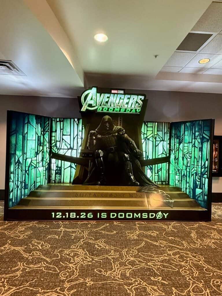 First look at the theater standee for Avengers: Doomsday, featuring Doctor Doom seated on his throne.