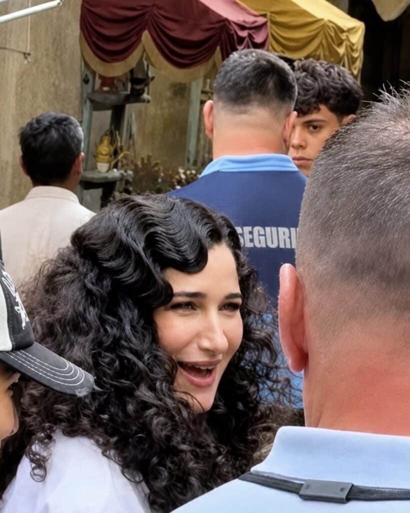Leaked set photos reveal Kathryn Hahn's first look as Mother Gothel in Disney's live-action Tangled, featuring a costume inspired by the animated classic.