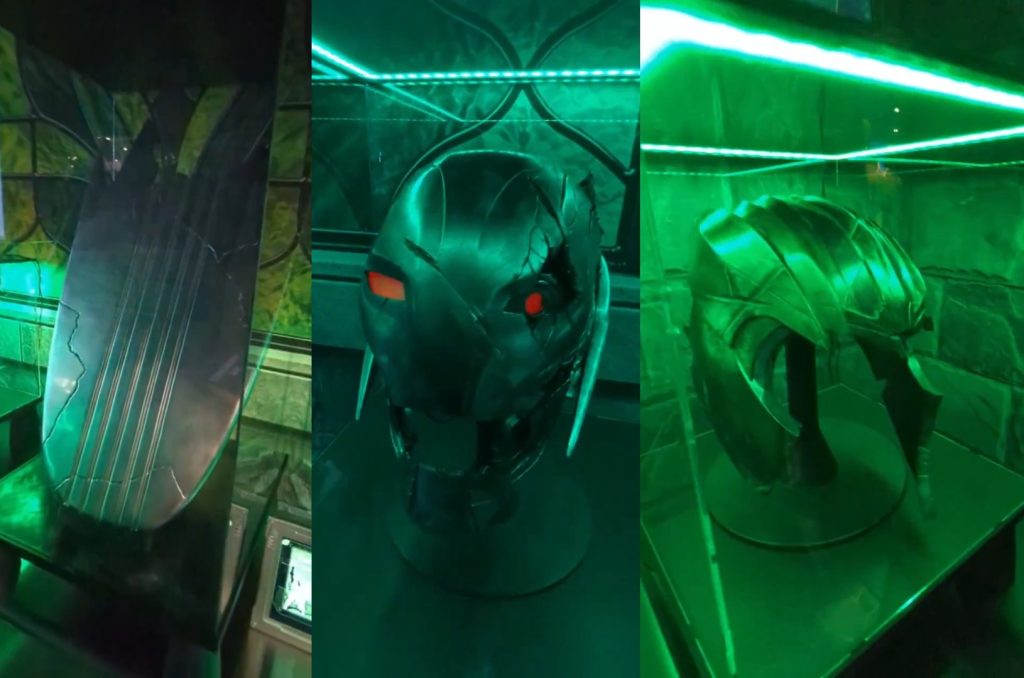 Marvel reveals Doctor Doom’s lab at New York Comic Con, featuring a symbiote sample, Silver Surfer’s split board, Ultron’s head, and Thanos’s broken helmet.
